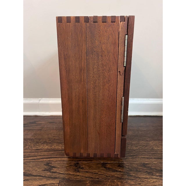 Charming vintage Karoff tabletop mini bar cabinet in richly toned walnut wood, designed with a clever pull-out drawer that...