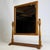 A charming 20th-century English dressing table mirror, finely crafted from oak and distinguished by its compact...