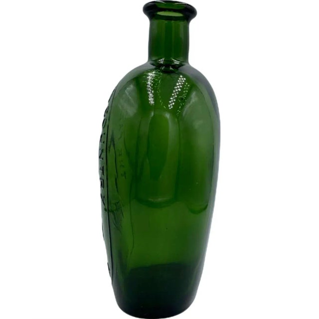Details: -Bottle is dark green glass and reads: "The Father of His Country Washington" and features a profile of George...