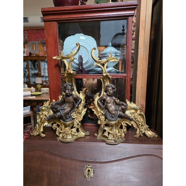 Beautiful antique French gilt bronze chenets with cherubs.