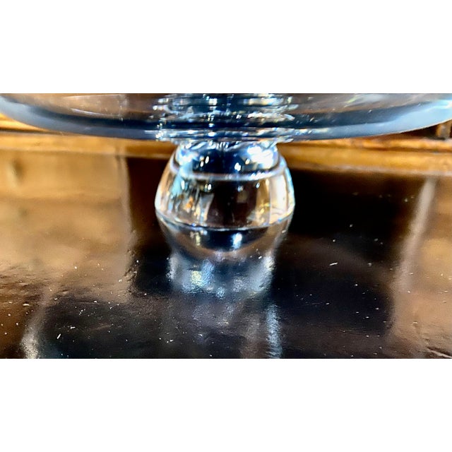 This is a charming and unusual mid-century Steuben cake stand. The stand measures 10 inches in diameter and stands 3...