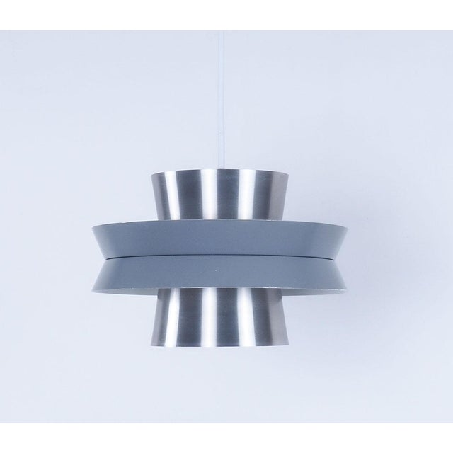 Vintage metal pendant lamp with a grey lacquered center ring. model trava designed by carl thore for granhaga...