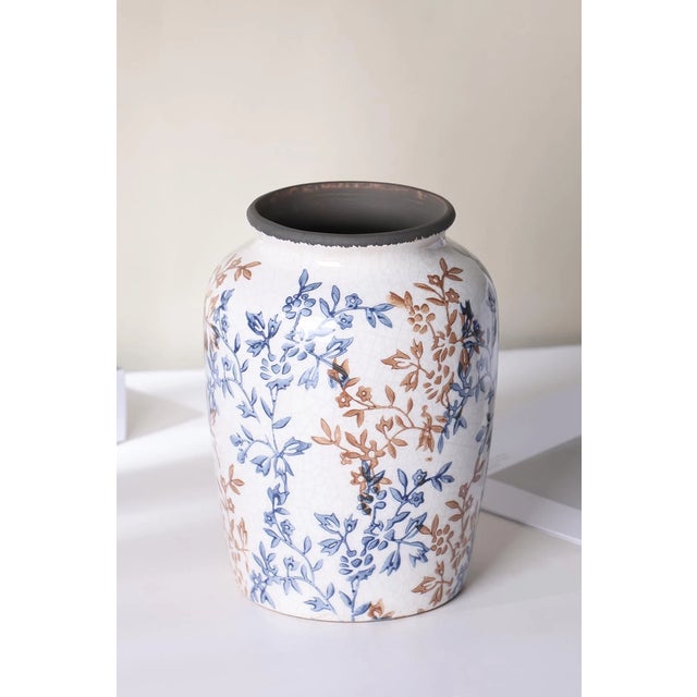Striking vintage Chinoiserie ceramic flower vase in rich shades of blue, featuring a distinctive ice-cracked (crackle...