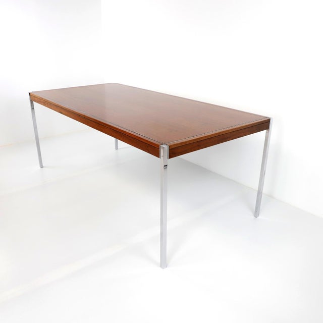 Dated 1973, We offer this Rare Early Florence Knoll Rosewood Dining Table, designed to furnish the new interiors of...