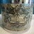 This mid-20th century vintage ice bucket features a charming Old World map design wrapped around its exterior, evoking a...