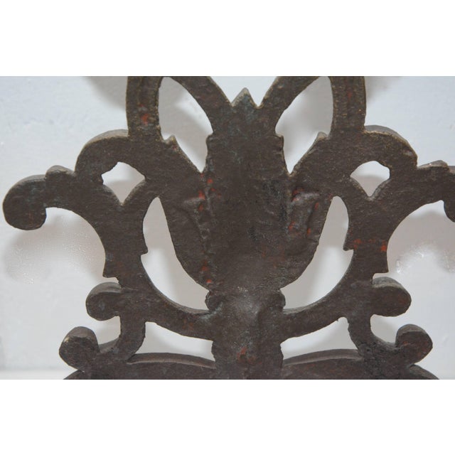 We are featuring a fabulous cast iron fireplace screen from the Victorian era. The piece is a darl brass tone in color and...