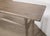 A beautifully rustic console table crafted from solid elmwood, dating to the first half of the 20th century. The long,...