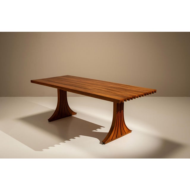 A rare and sculptural dining table attributed to the Italian architect Filippo Monti, this set captures the spirit of...