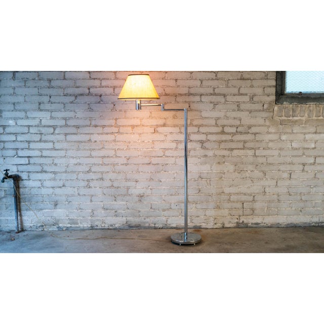 Mid Century Modern Swing Arm floor lamp designed by Casella Lighting, circa 1970s. Polished chrome design with heavy...