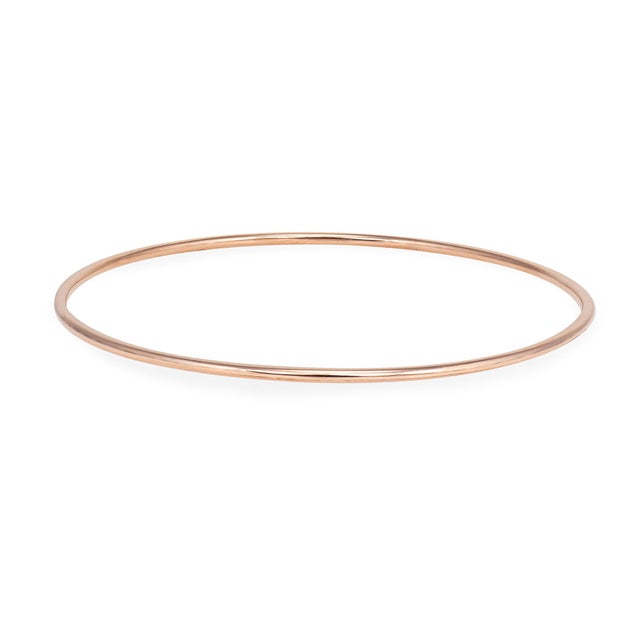 Chic vintage bangle bracelet crafted in 19 karat Portuguese rose gold (circa 1980s). Simple and elegant, the bangle is...