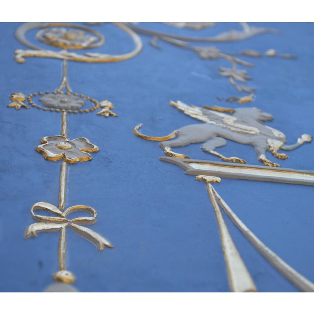 Light blue decorative wall panel with white and gold reliefs, handmade in Italy by Cupioli. Elegant decorative wall panel,...