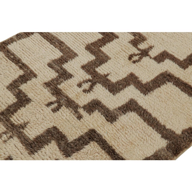 Hand-knotted in wool, this 4x4 vintage Tulu rug, circa 1950-1960, is among the family of Tulus with minimalist geometric...