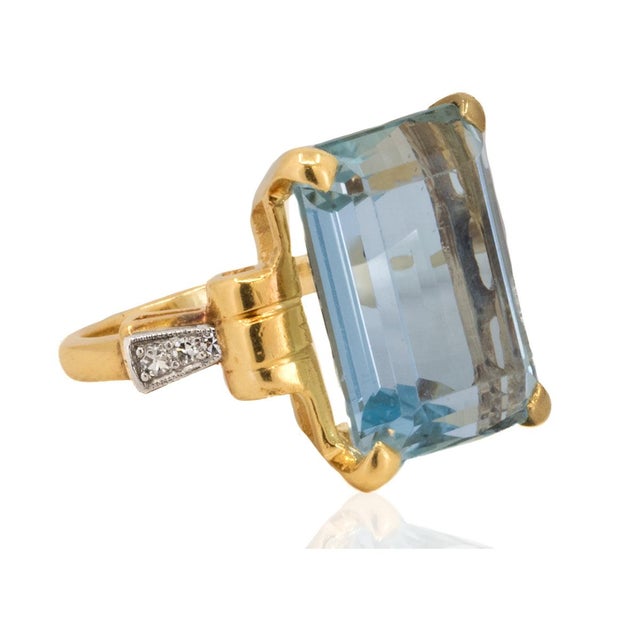 14k Retro Period ring with approximate 11.00 carat aquamarine and 6 accent diamonds. 6.70g