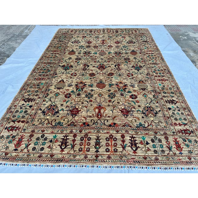 This breathtaking hand-knotted wool area rug features an elegant Sultanabad design with a Chobi finish. The central field...