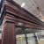 2010s Howard Miller Townsend Lighted Curio Cabinet 680-235, Windsor Cherry With Mirrored Back For Sale - Image 5 of 10