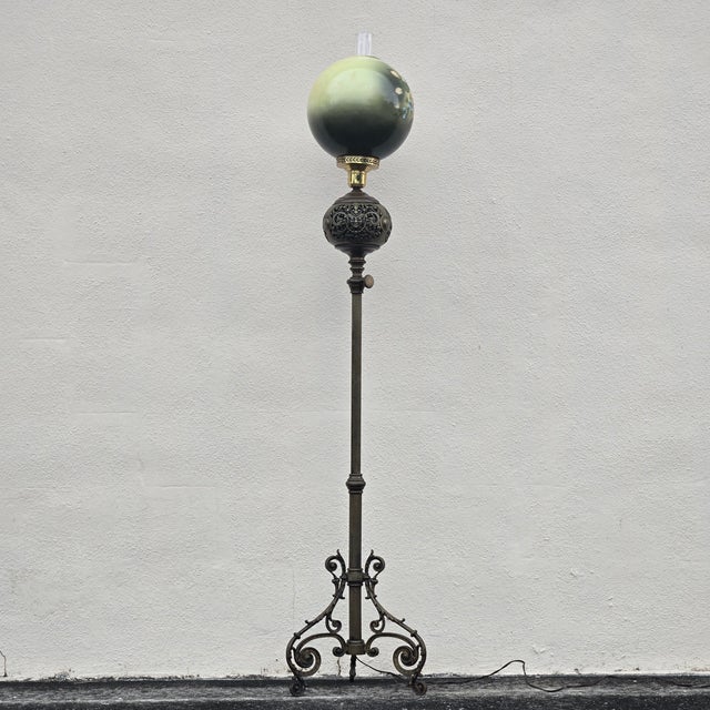 This lovely floor lamp has undergone a vintage conversion from oil to electric, allowing the hand-painted 10.5 inch...