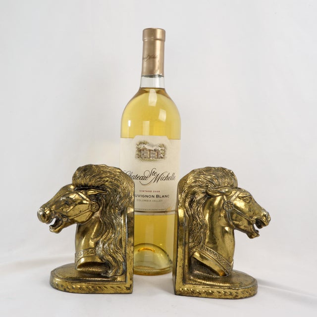 Shiny golden horsehead bookends that show movement and emotion. They are a spirited pair of bookends. The molded pot metal...