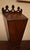 Wall box for pipes, 19th century, walnut. A swagged pierced crest rail is above a sloped lid with a thumbnail molded edge....