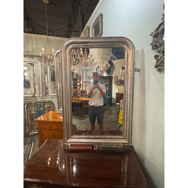The product is a 19th century French Silver Louis Philippe mirror, featuring a classic design with an x pattern and...