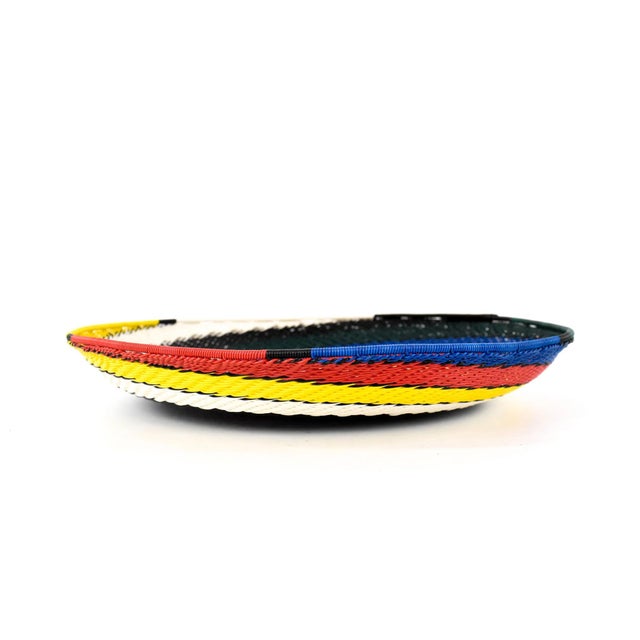 Zulu Telephone Wire Baskets from South Africa epitomize the fusion of traditional craftsmanship and contemporary...