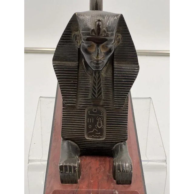 Early 19th Century French Egyptian Revival Sphinx. The bronze Sphinx is incredibly detailed and mounted on a two-toned...