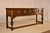 Circa 1900 period Edwardian oak sideboard from England. The top is richly grained and has a beveled and molded edge,...