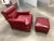 American Art Deco club chair and ottoman with walnut legs in red naugahyde, circa 1940s.