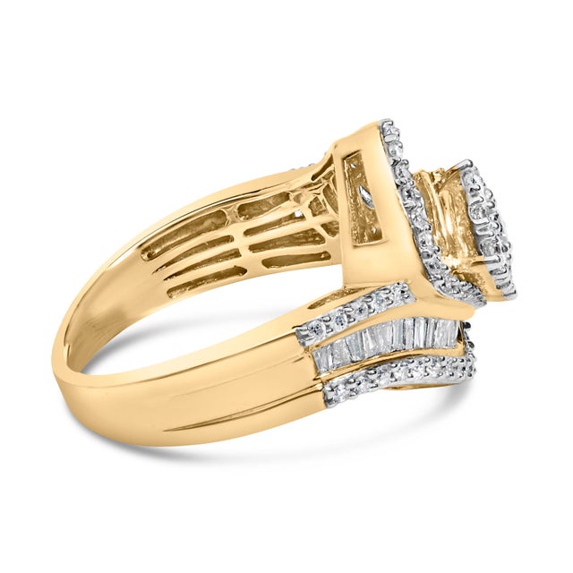 A stunning diamond bypass ring created in 14k yellow gold. This beautiful piece is embellished with round and baguette cut...