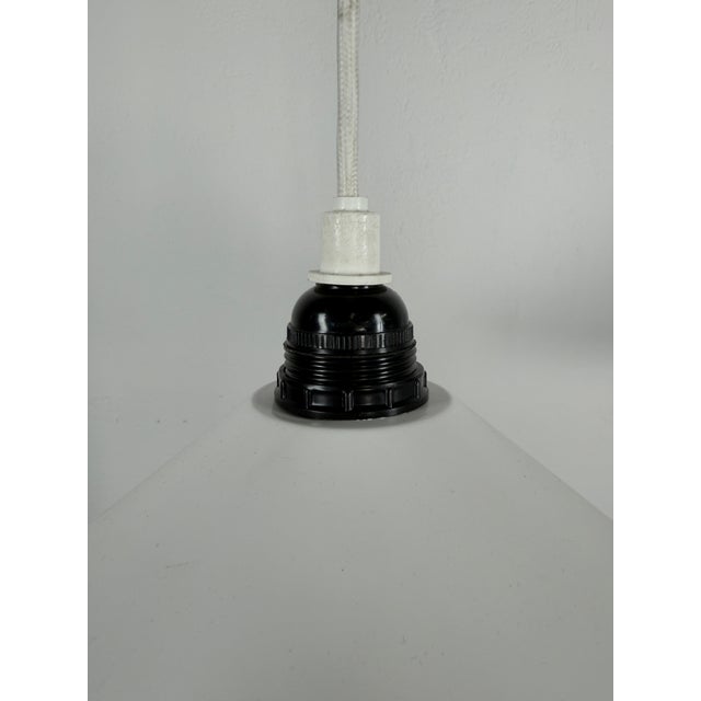 Original pair of Danish pendant lamps from the 1970s, designed in the classic Scandinavian Modern aesthetic. The timeless,...