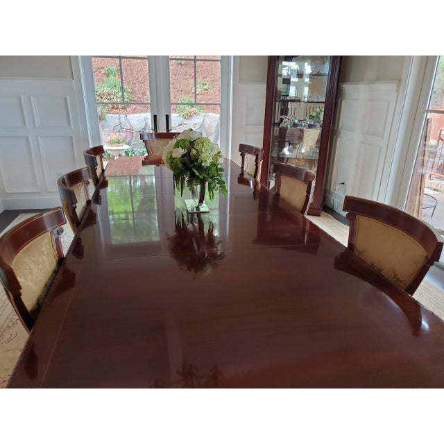 A gorgeous, elegant John Widdicomb Georgian table; this burl walnut and mahogany table pairs perfectly with the set of...