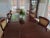 A gorgeous, elegant John Widdicomb Georgian table; this burl walnut and mahogany table pairs perfectly with the set of...