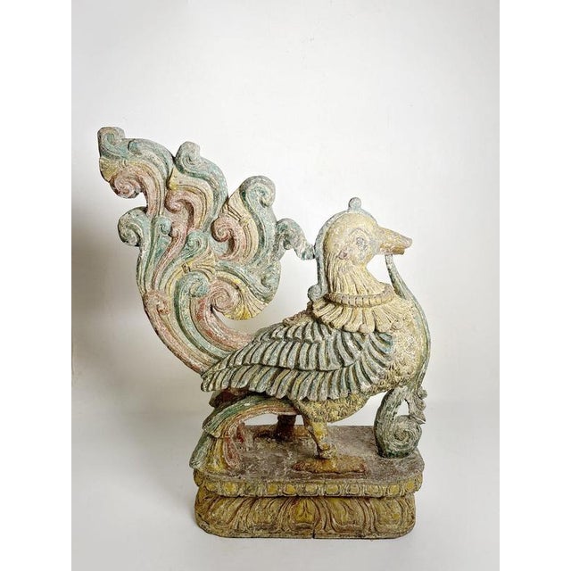 Decorative French wooden rooster sculpture dating from the 19th century. The bird is depicted with an elaborate stylized...