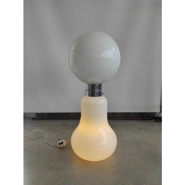 1960s space age floor lamp. The lamp is made of hand-blown white Murano glass and takes the shape of a skittle. with its...