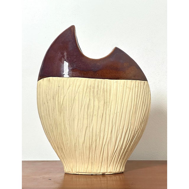 Sculptural Ceramic Vase from the 1970s, Made in Italy. A vintage 1970s glazed ceramic vase with a strong sculptural and...