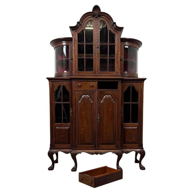 An exceptional 19th-century Queen Anne style walnut display cabinet, distinguished by its impressive proportions,...