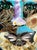 From green, Beauty Blooms...this mixed media piece by California artist Adria Becker features flowers, leaves, and a...