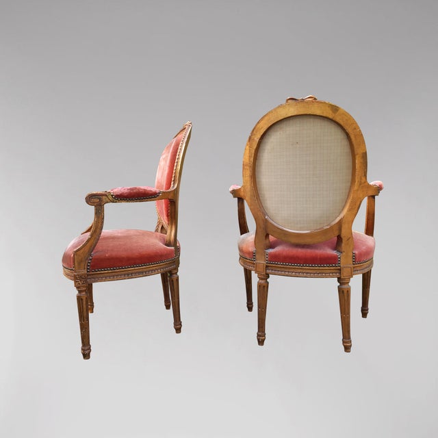Pretty pair of Louis XVI style armchairs in gilded wood with medallion backs. Pretty ribbon carved at the top of the...