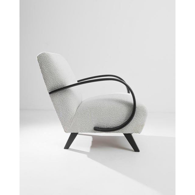 Step into the elegance of the 1930s with this exquisite Czech Wooden Armchair by J. Halabala. Renowned for its impeccable...