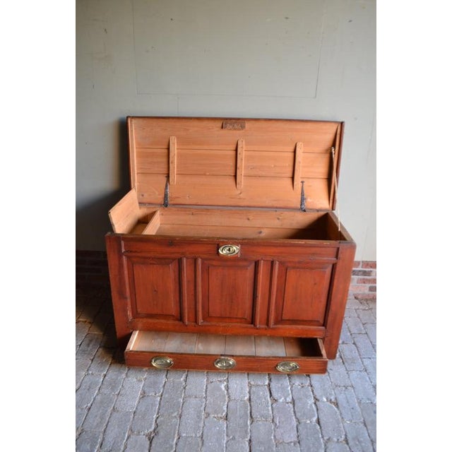of an 18th-century Dutch wooden blanket chest made of fruit trees. The height is 77 cm. The width is 126 cm. The depth is...