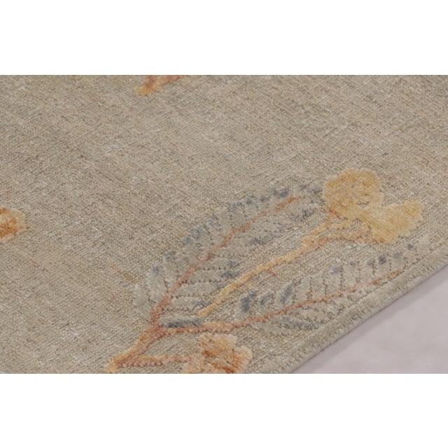 Hand-knotted in a luxurious blend of wool and silk, this 6x8 rug is a serene and sophisticated addition to the Block Print...