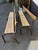 Pair of stackable school benches in light wood and brown metal. Good overall condition, paint chipped on the legs.