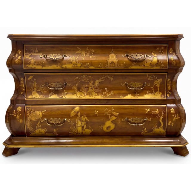This is a Dutch Rococo style chinoiserie bombe chest by White Furniture. It is a double bombe walnut chest with carved...