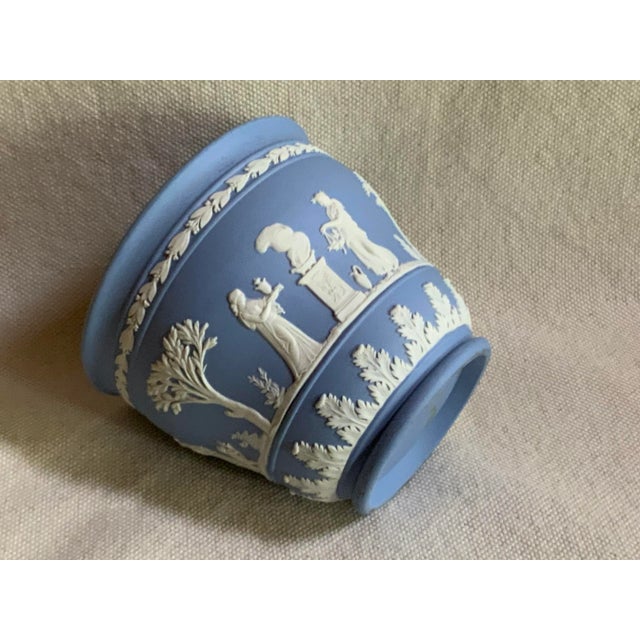 A delightful mid-century classical styled Wedgwood jasperware cache pot in the famous Wedgwood blue that collectors adore....