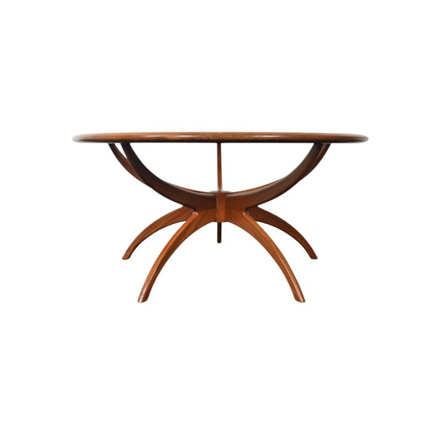 Origin: England Designer: Victor B. Wilkins Manufacturer: G Plan Era: 1966 Materials: Afromosia, Glass Measurements: 35.5"...