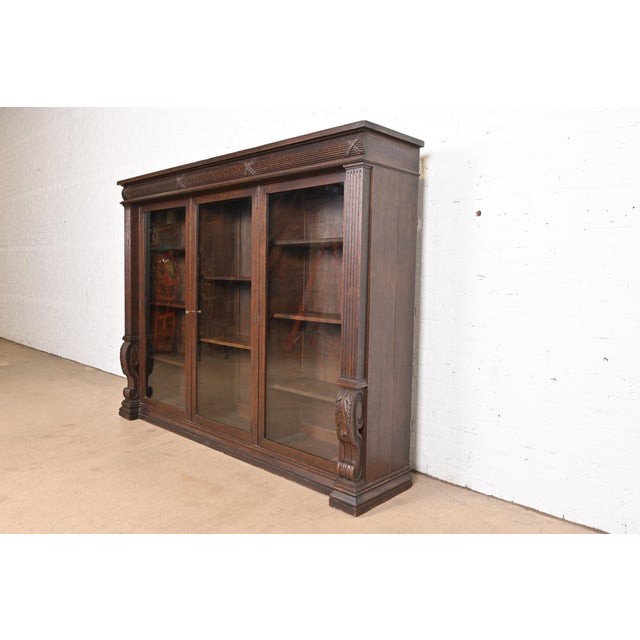 A gorgeous antique American Empire or late Victorian triple bookcase In the manner of R.J. Horner USA, Circa 1900...