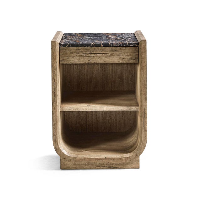 The Nightstand with marble top combines sculptural style with practical storage. Its rounded shape and balanced...