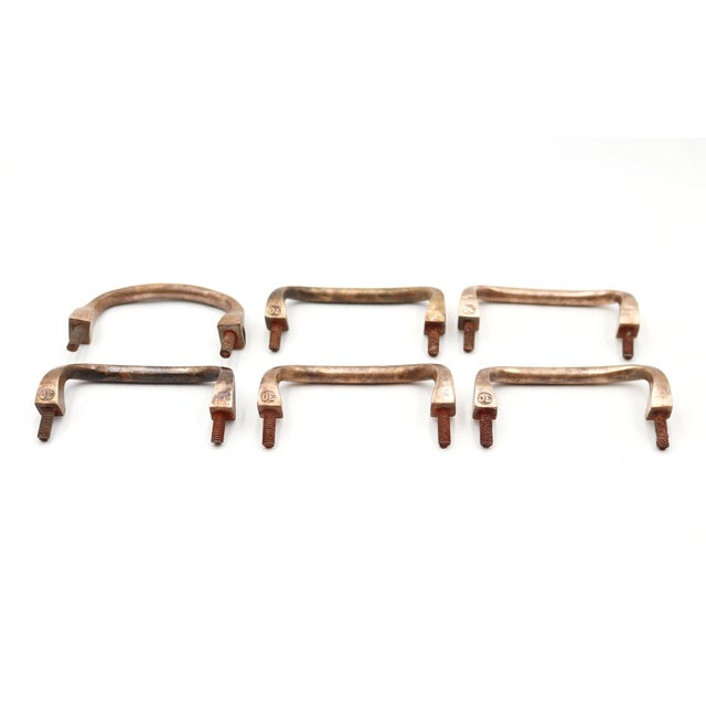 Vintage curved drawer or cabinet pulls made of brass with a polished finish. The hanger bolts are rusted. Stamped 30. Good...