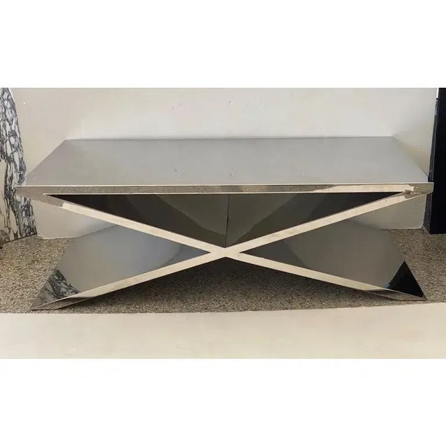 This stylish and substantial X-form polished stainless steel cocktail table was acquired from a Palm Beach yacht and thus...