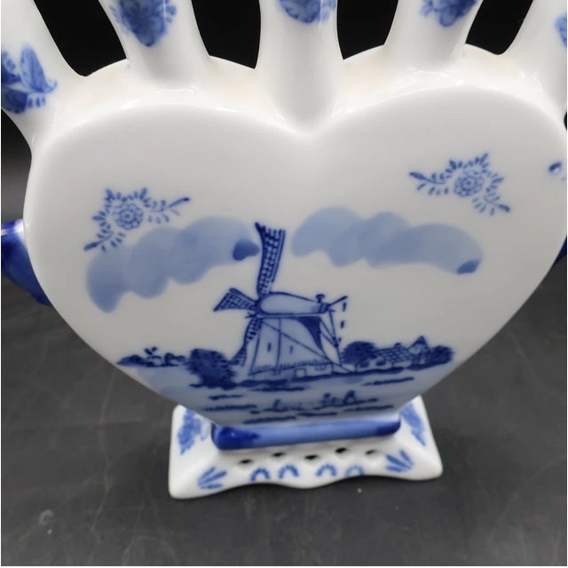 Charming vintage Delft Blue tulip vase made by Royal Twickel in Holland. This beautiful piece features the classic...