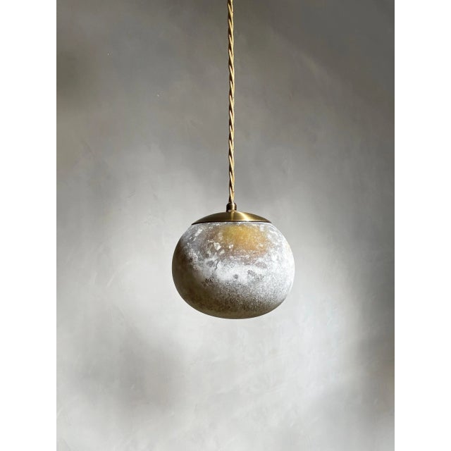 Salty ball 20 pendant by contain dimensions: ø 20 x h 100 cm (custom length). Materials: blown glass from local production...